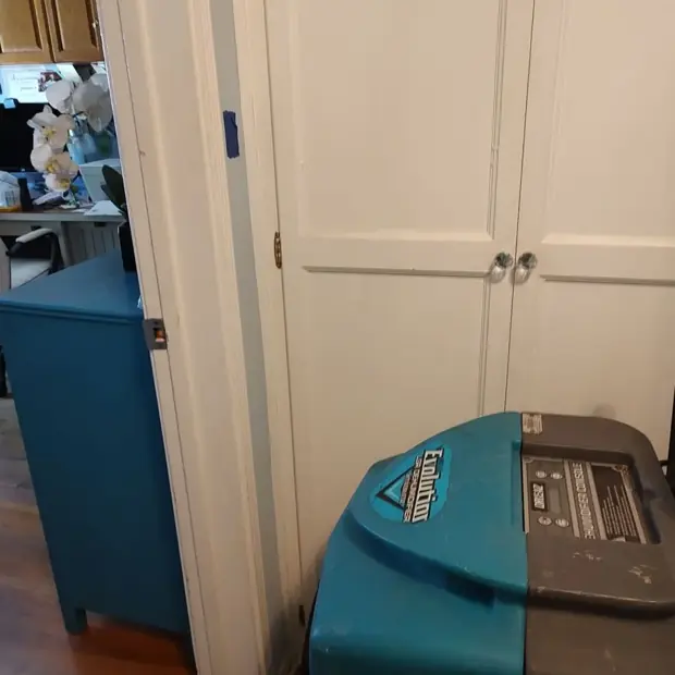 Dehumidifier set in a hallway closet during drying in Canoga Park